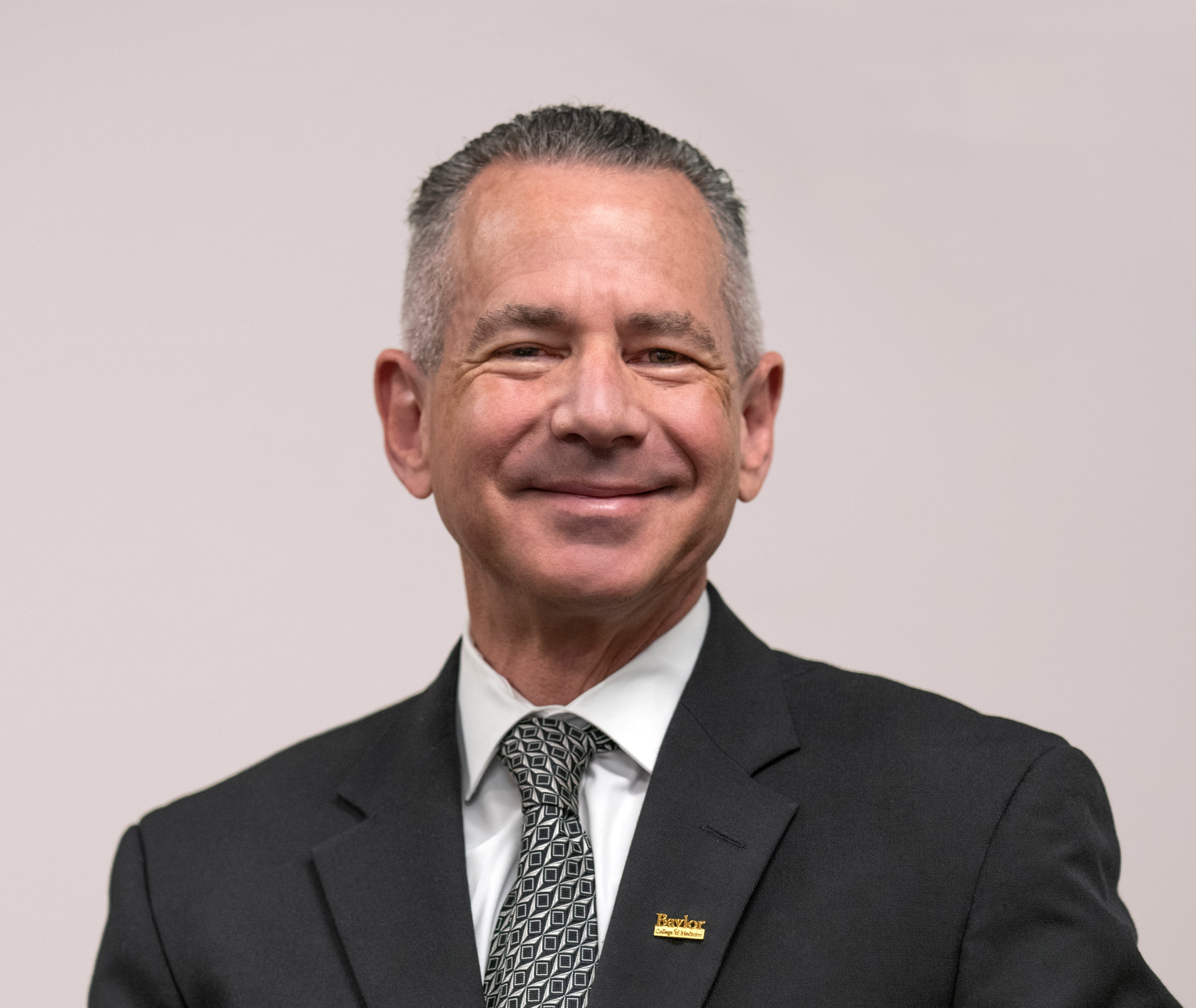 Portrait of David Allison facing the camera with a relaxed expression, professional headshot used for David Protein branding.